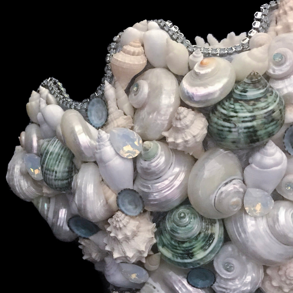 Left side of coral centerpiece featuring pacific opal swarovski © crystals and natural seashells