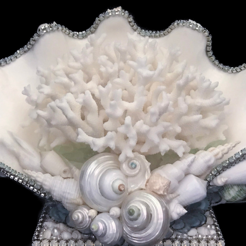 Close up of coral centerpiece featuring pacific opal swarovski © crystals and natural seashells